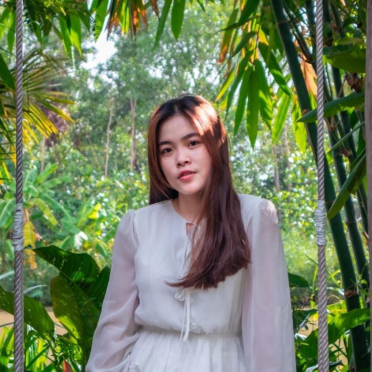 Aanya Rao, Lead Design Curator at RidgeFieldStudio, reviewing corporate floral arrangements